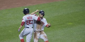 Red Sox players celebrate after a run